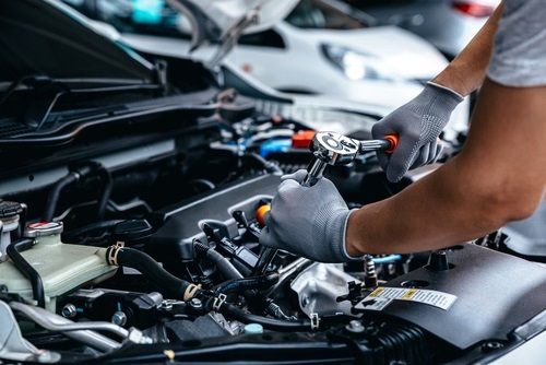 Mechanic tuning a car