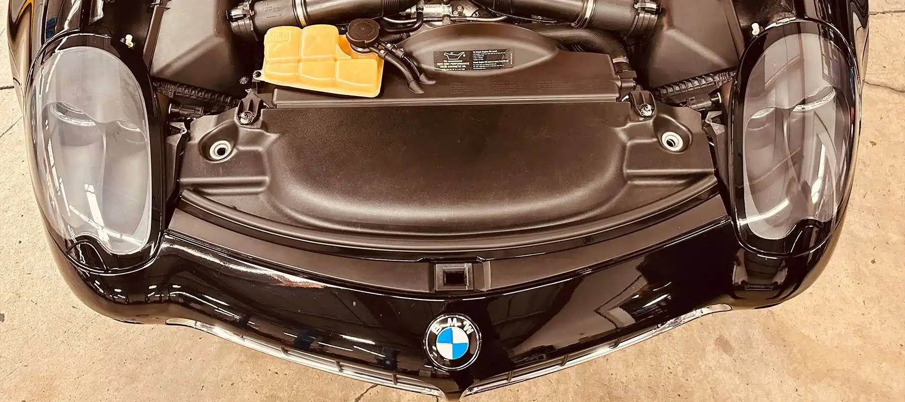 BMW with hood up