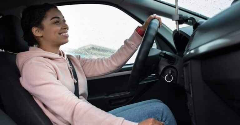 Young woman driving a car