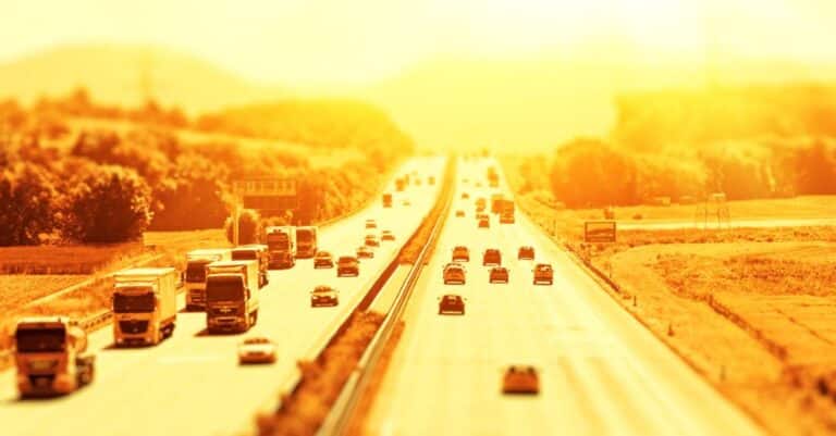 Cars in traffic in the summer