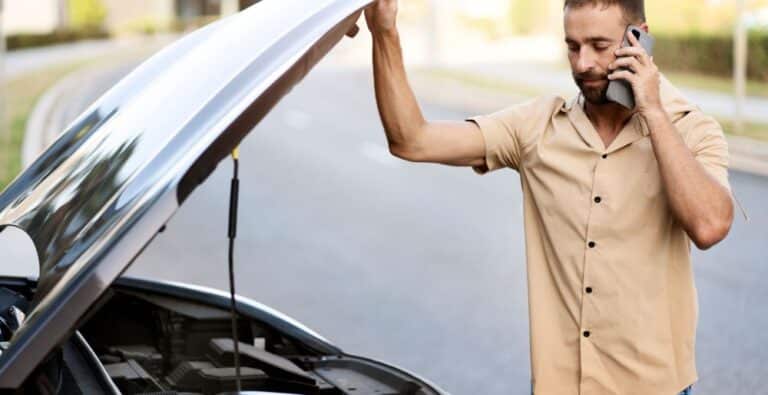 Man calling for repair on the side of the road